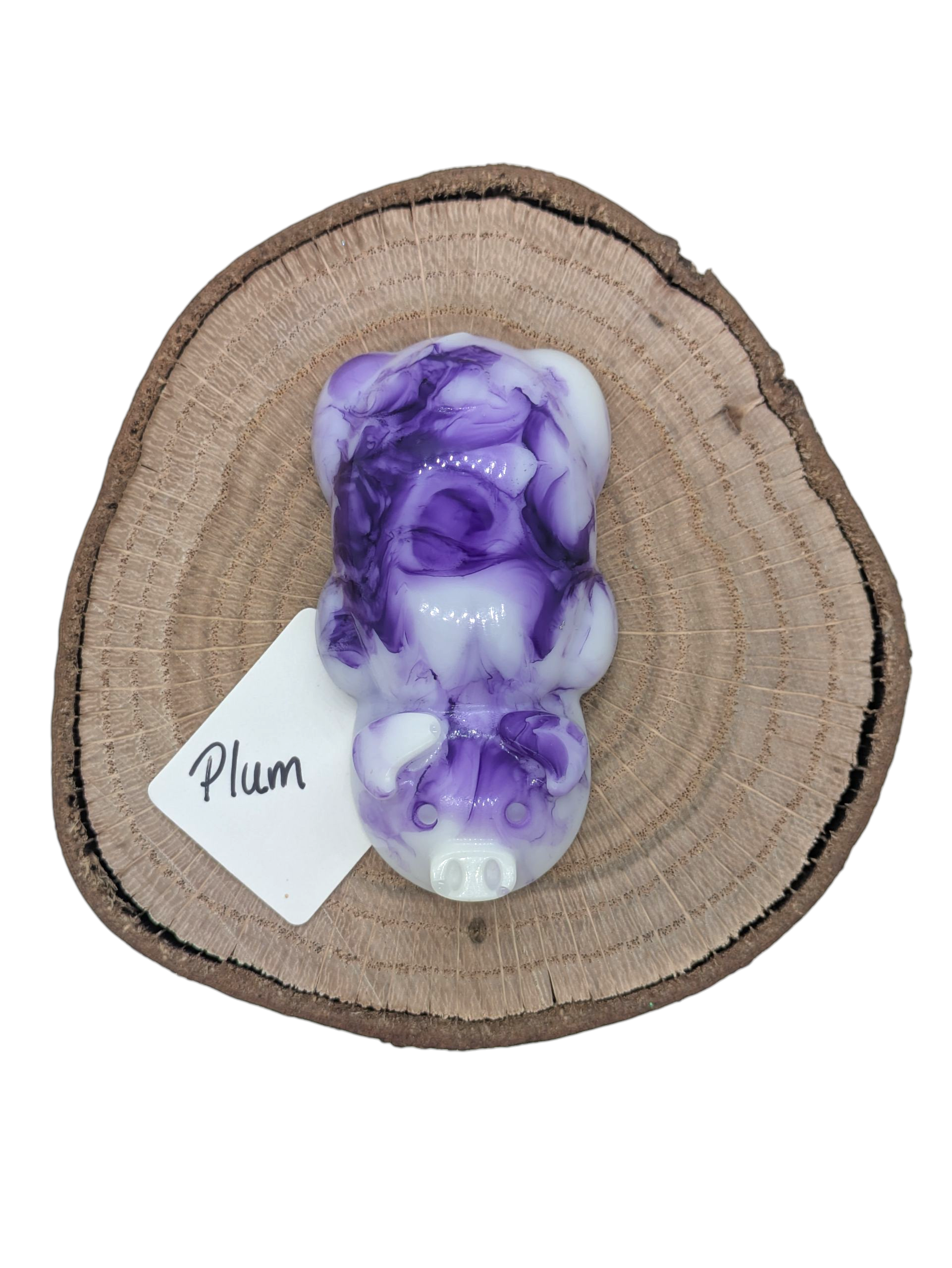 Resin pig figure in plum color