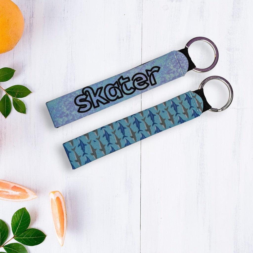 neoprene wristlets with key ring printed with 'skater' or shark pattern