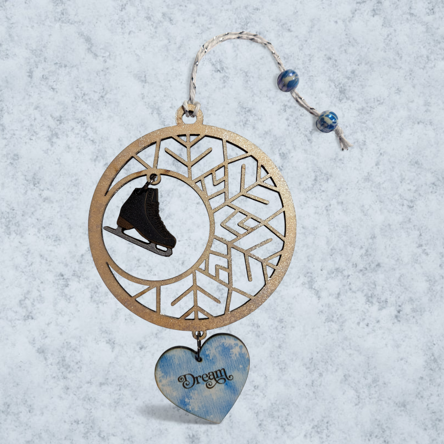 Snowflake ornament with hanging figure skate and 'Dream' heart